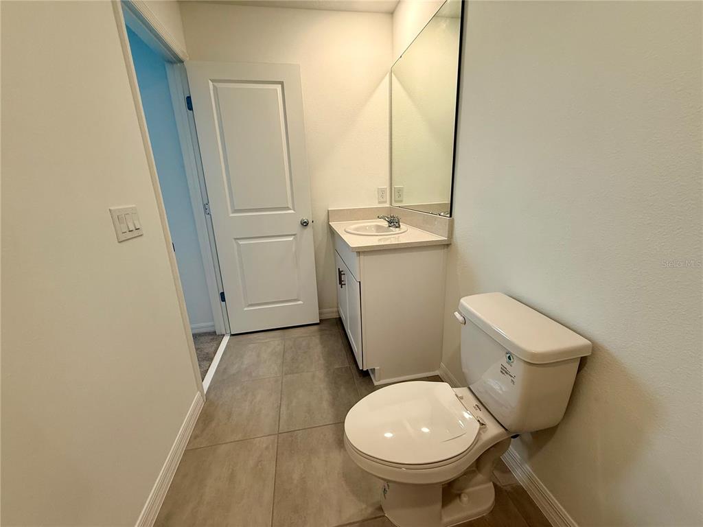 2996 Skyline Loop Kissimmee, FL 34758 - Photo 22 of 26 a bathroom with a sink toilet and shower
