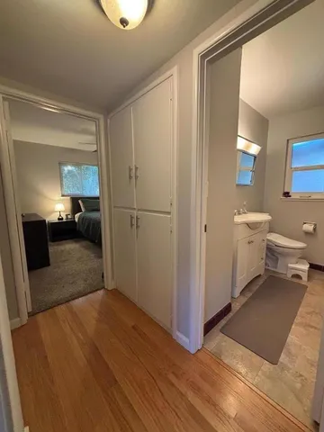 a bedroom with a bed and a mirror