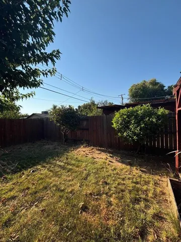 a view of backyard with green space