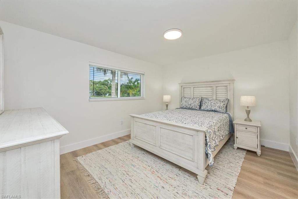 3560 Corana Way Naples, FL 34105 - Photo 12 of 24 a bedroom with a bed and a window