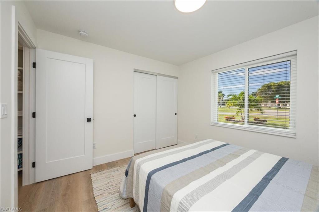 3560 Corana Way Naples, FL 34105 - Photo 16 of 24 a bedroom with a bed and a window