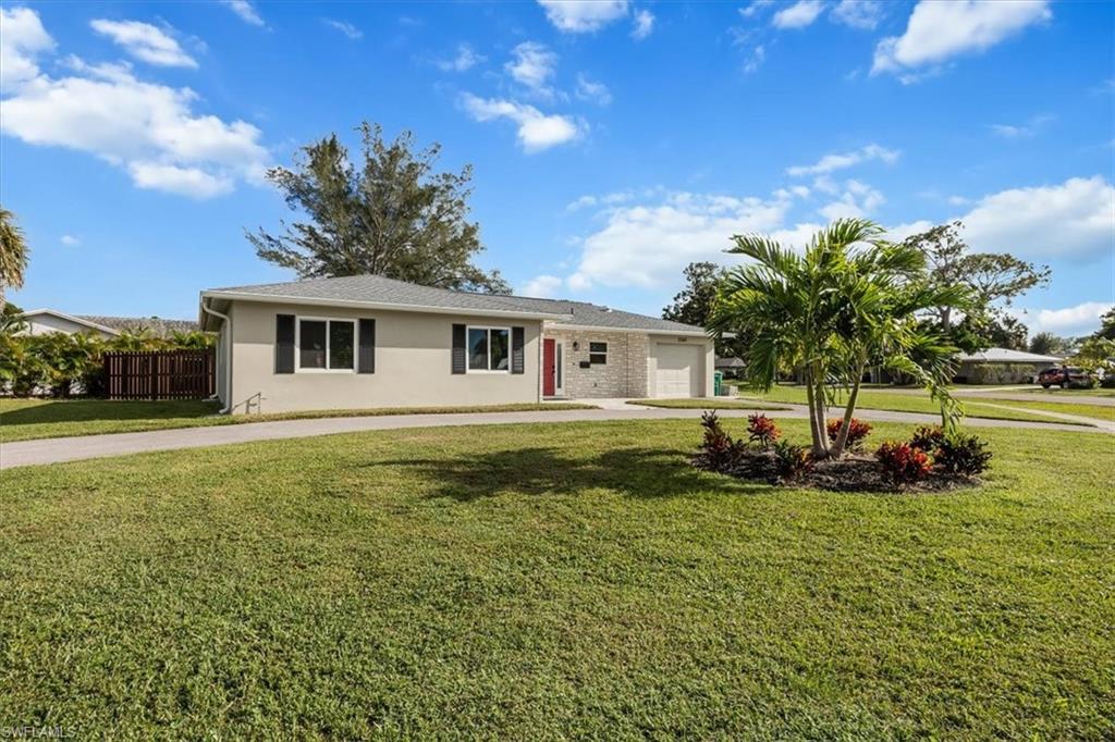 3560 Corana Way Naples, FL 34105 - Photo 2 of 24 a view of a house with a yard
