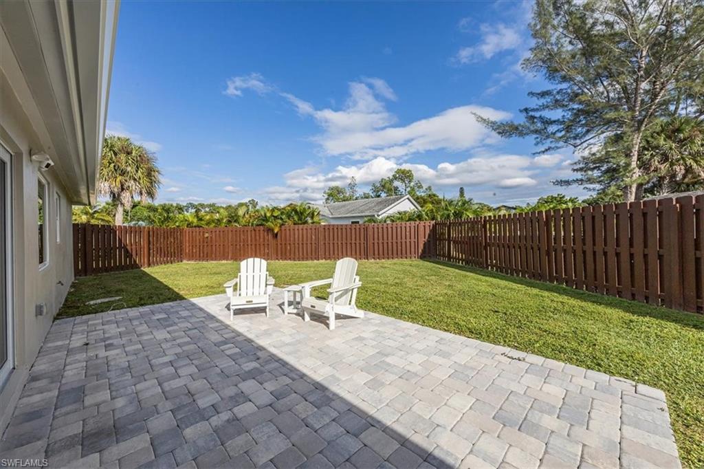 3560 Corana Way Naples, FL 34105 - Photo 21 of 24 a view of a backyard with sitting area