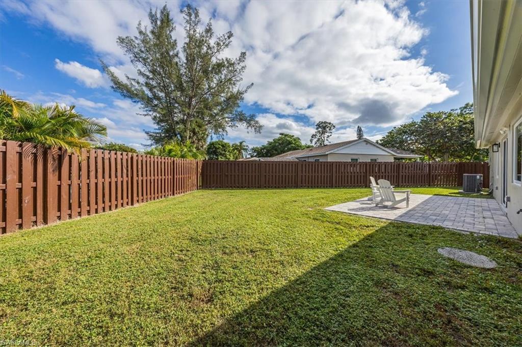 3560 Corana Way Naples, FL 34105 - Photo 22 of 24 a view of a garden