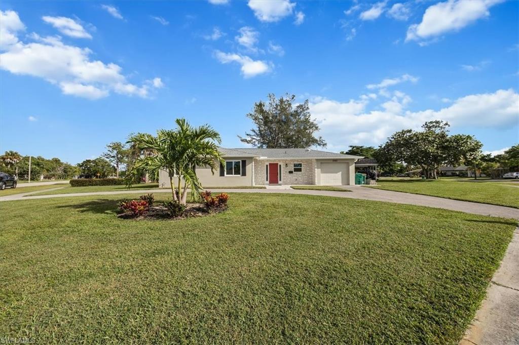 3560 Corana Way Naples, FL 34105 - Photo 23 of 24 a view of a house with a yard