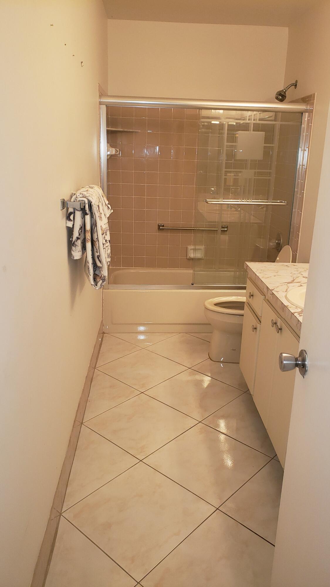 6085 Stanley Lane Delray Beach, FL 33484 - Photo 11 of 22 a bathroom with a shower