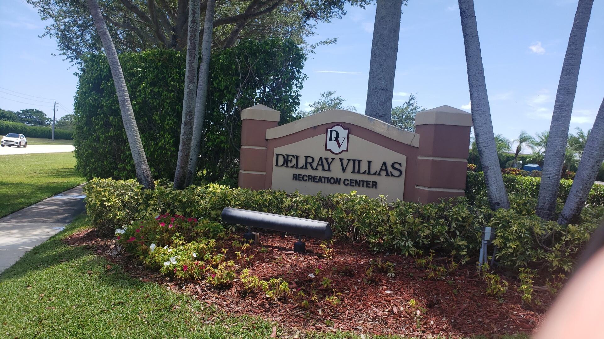 6085 Stanley Lane Delray Beach, FL 33484 - Photo 19 of 22 a sign on the side of the road