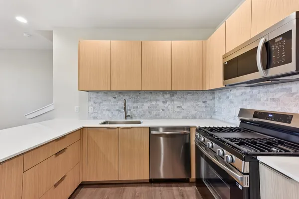 a kitchen with a stove and a microwave