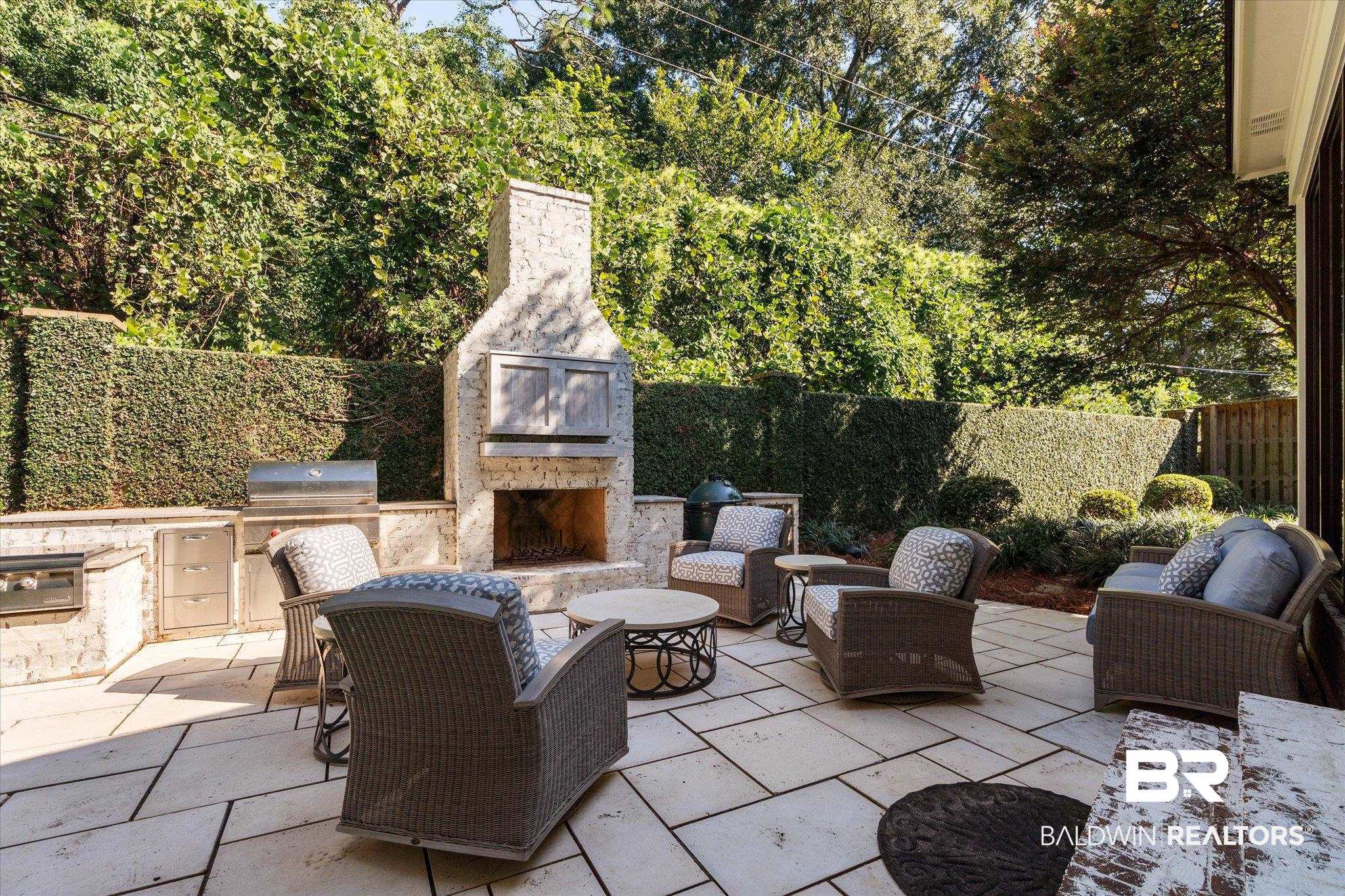 320 Long Court Mobile, AL 36608 - Photo 47 of 61 View of patio with area for grilling and an outdoor living space with a fireplace