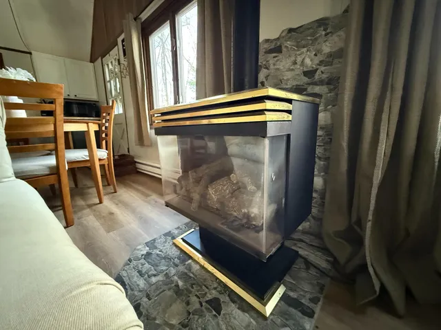 a living room with furniture fireplace and windows
