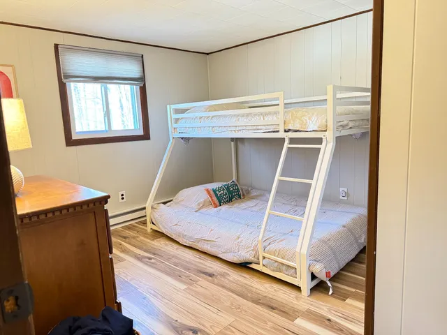 a bedroom with a bed and window