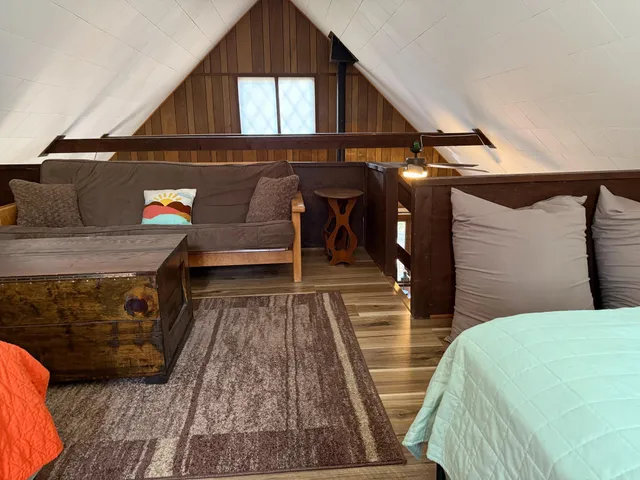 a view of an outdoor sitting area with wooden floor