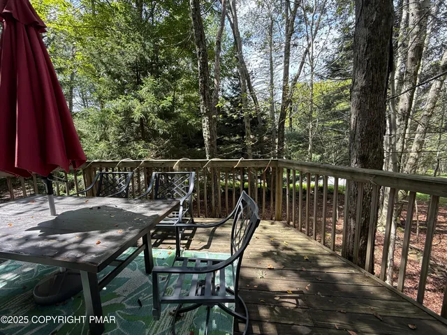 a view of a chairs and table on the deck