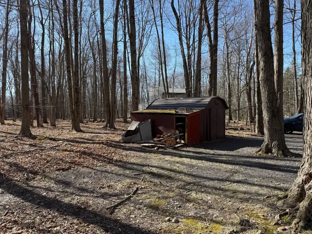 a balcony with chairs and wooden floor