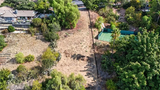an aerial view of residential house with outdoor space