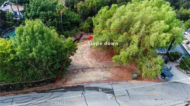 a backyard of a house with outdoor seating