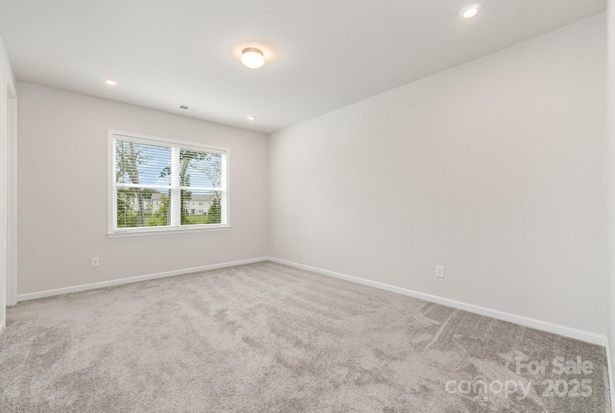 9029 Widden Way Charlotte, NC 28269 - Photo 18 of 29 an empty room with windows