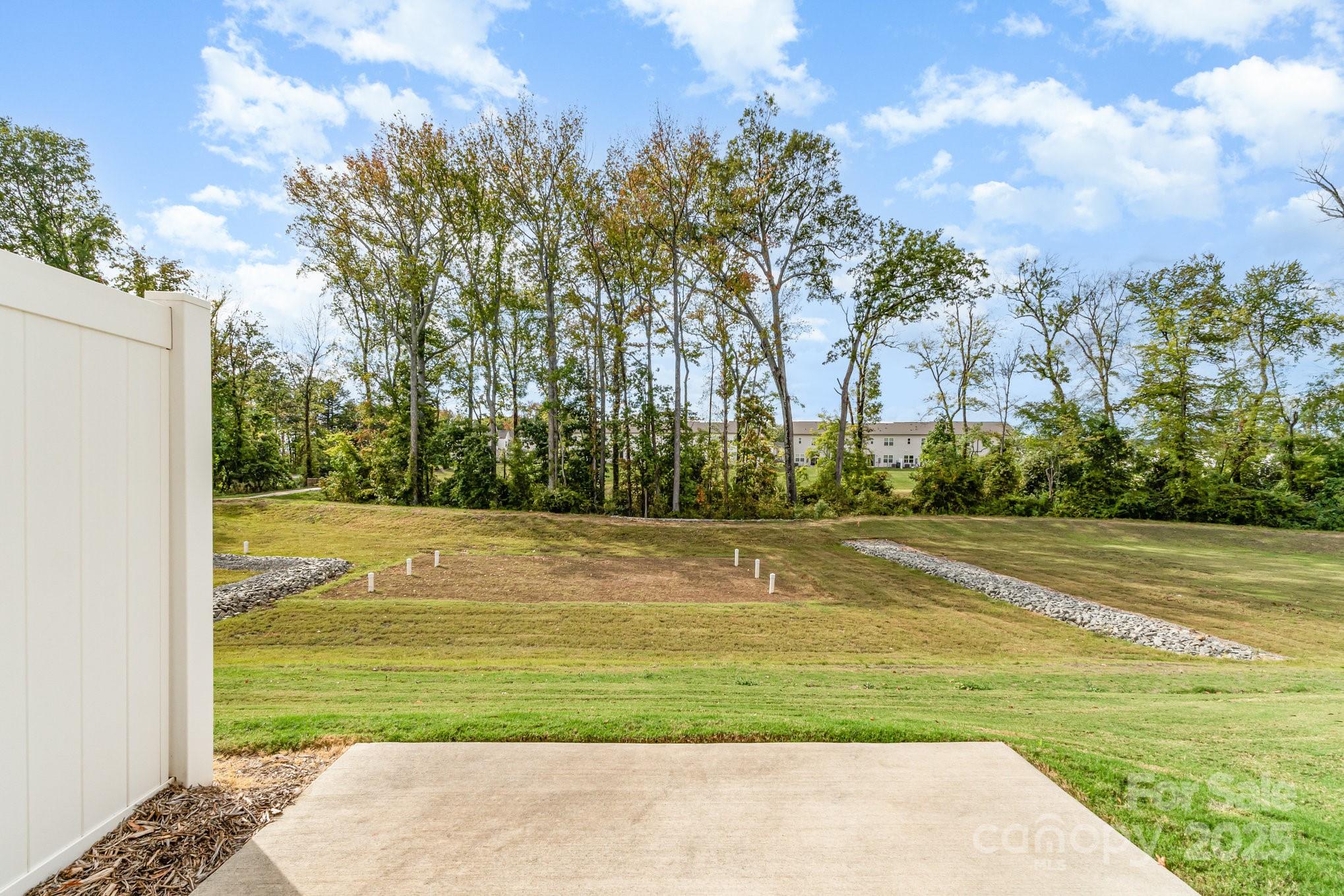 9029 Widden Way Charlotte, NC 28269 - Photo 2 of 29 a view of a swimming pool and a yard