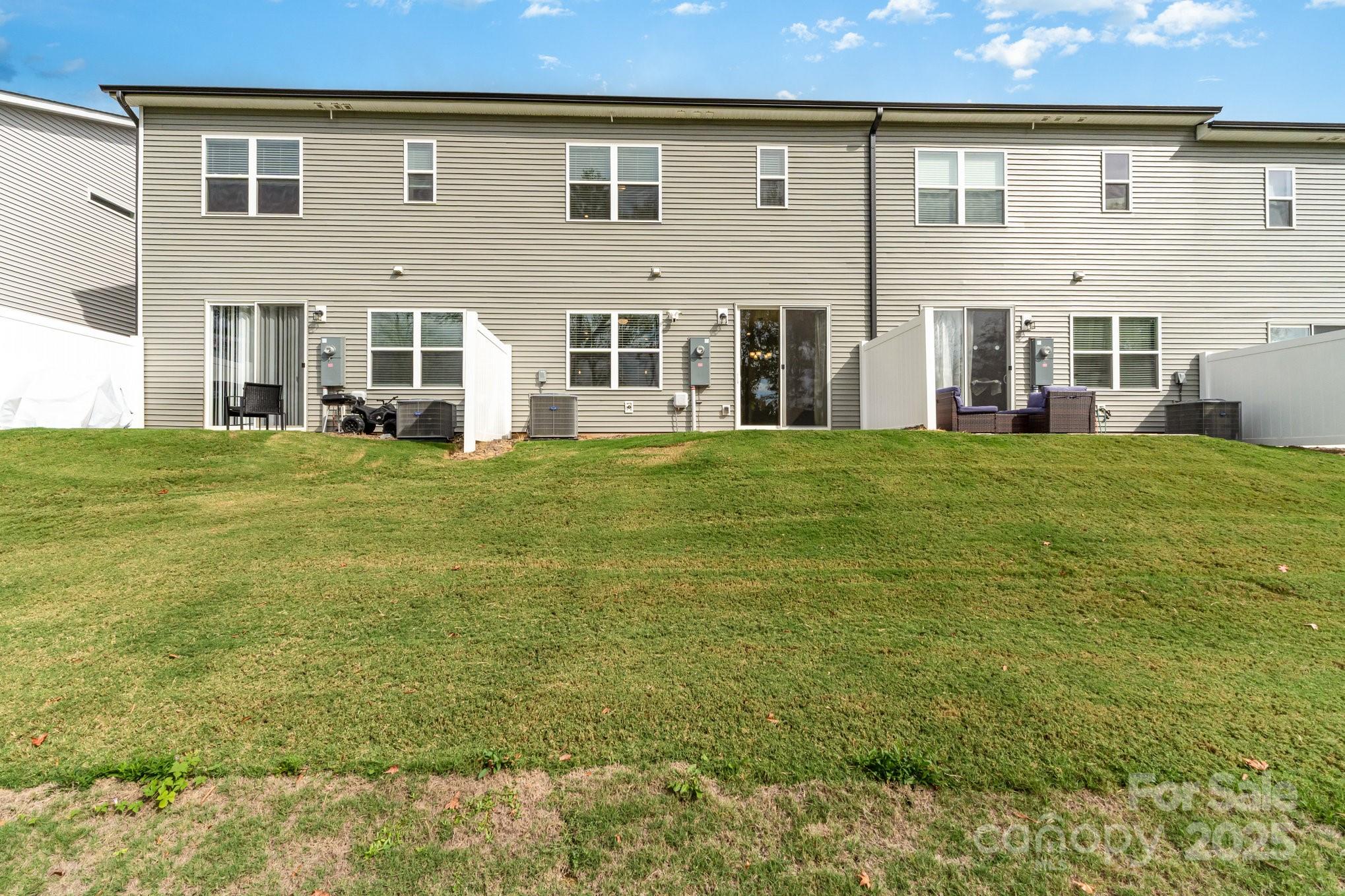 9029 Widden Way Charlotte, NC 28269 - Photo 28 of 29 front view of a brick house with a yard
