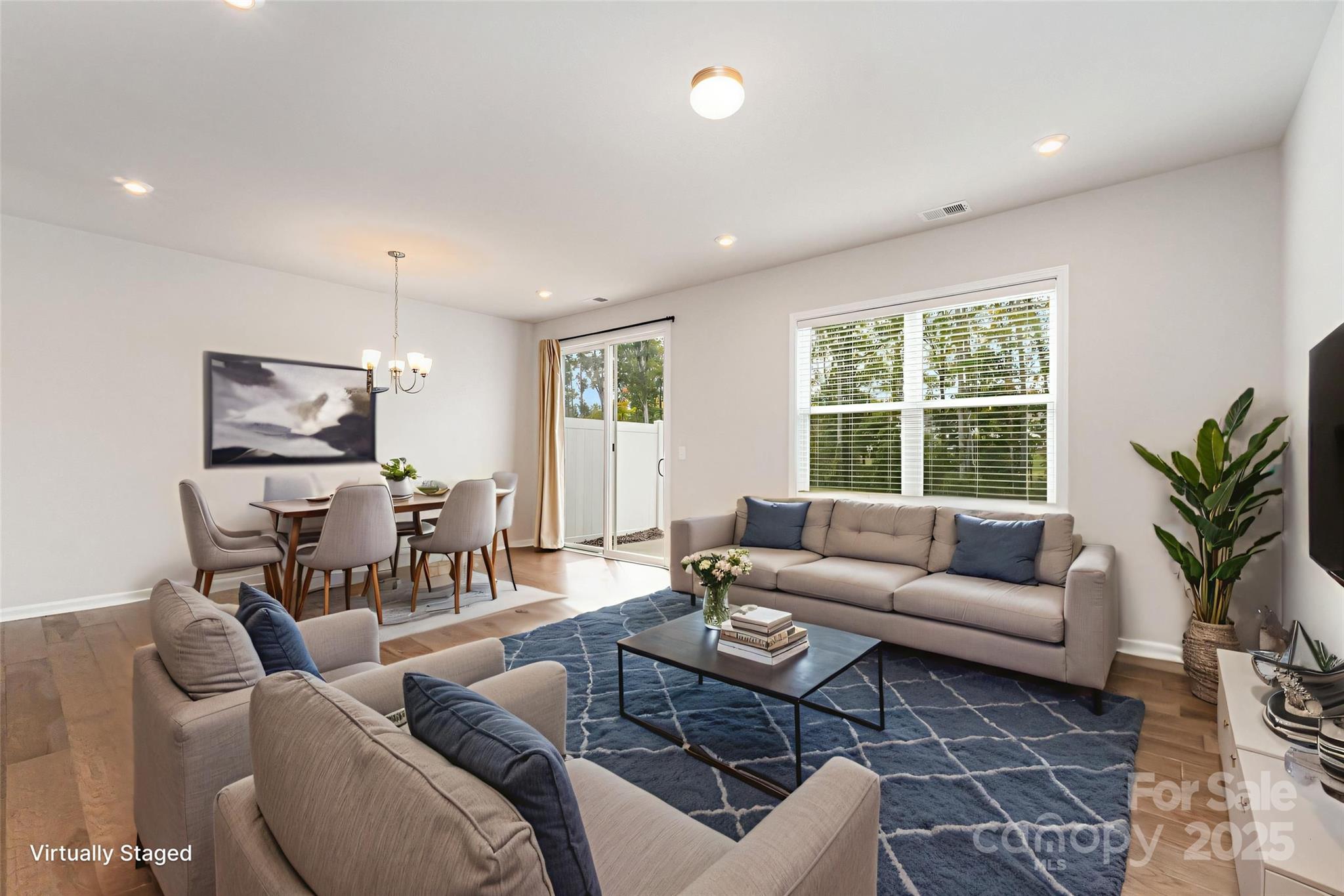 9029 Widden Way Charlotte, NC 28269 - Photo 3 of 29 a living room with furniture and a large window