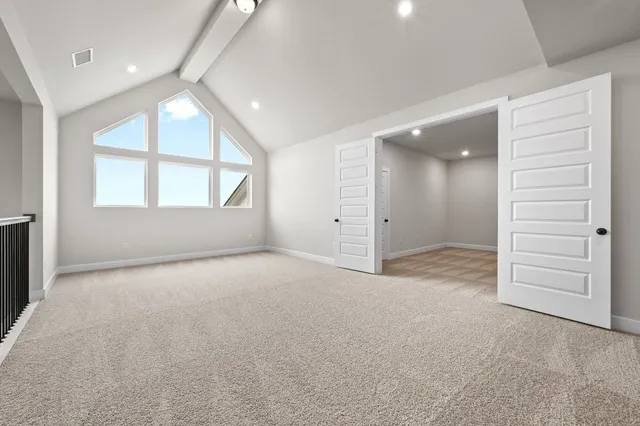 an empty room with windows and closet