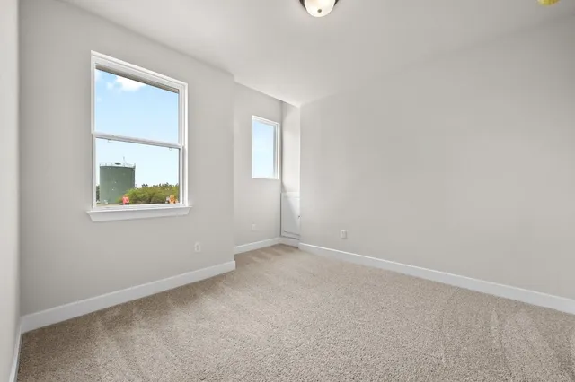 an empty room with windows