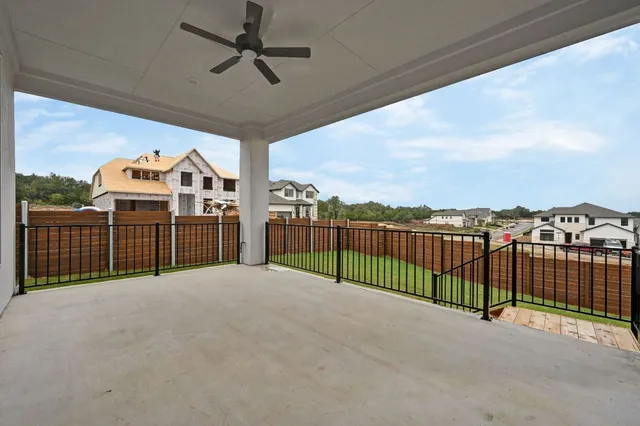 a view of a roof deck and a floor to ceiling window