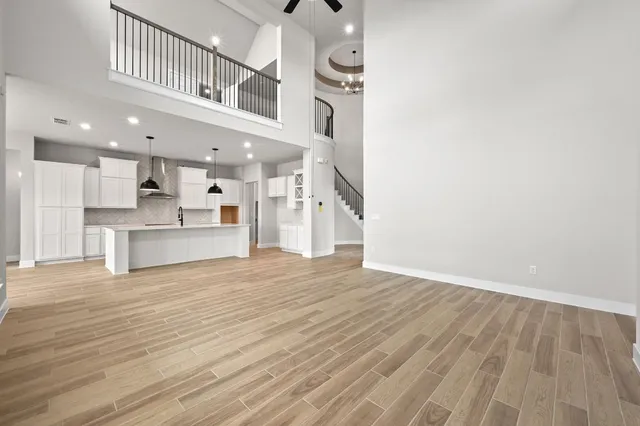a view of kitchen with furniture and wooden floor