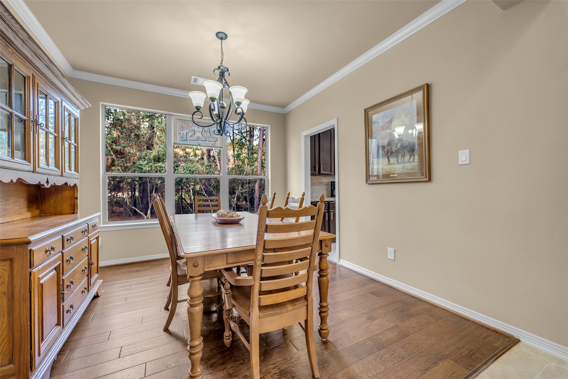 14752 Highland Ranch Drive Montgomery, TX 77316 - Photo 12 of 39 a view of a dining room with furniture a chandelier and wooden floor