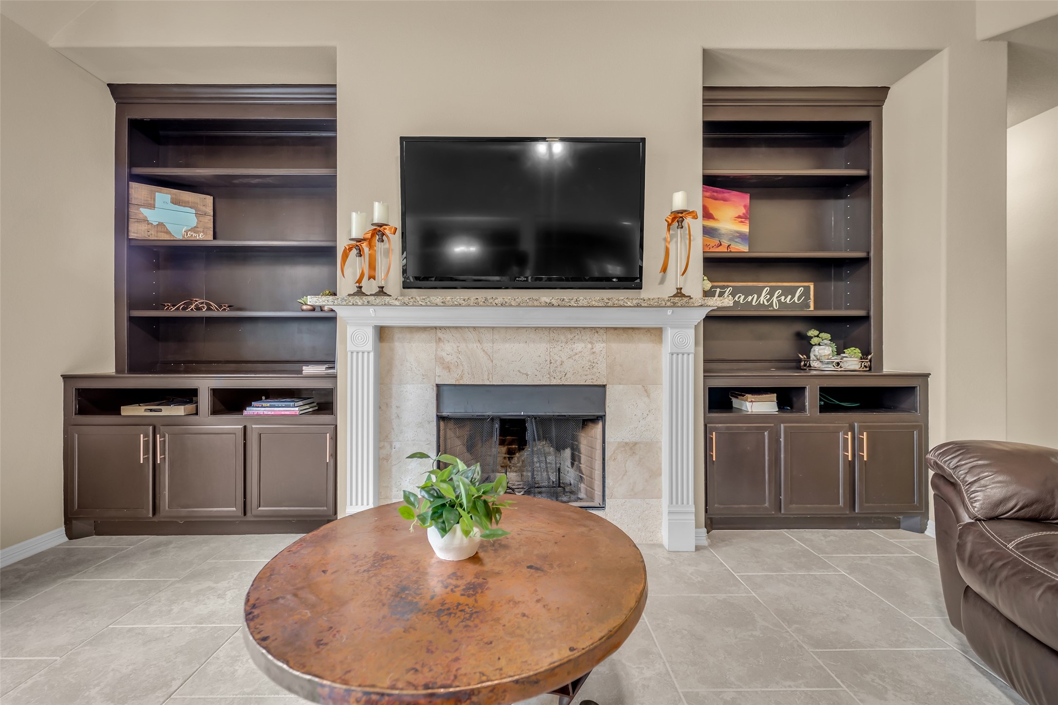 14752 Highland Ranch Drive Montgomery, TX 77316 - Photo 15 of 39 a living room with a fireplace and a flat screen tv