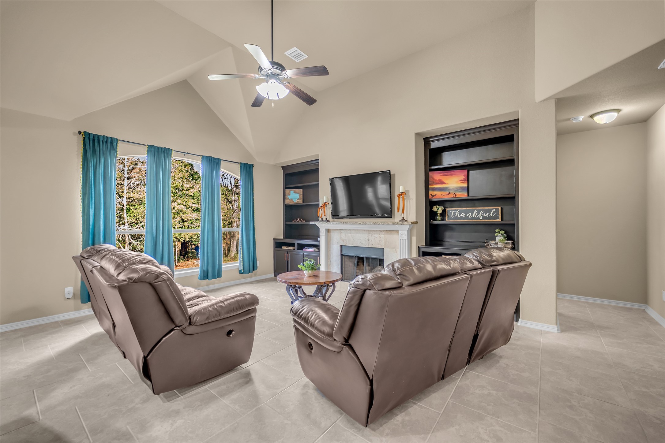 14752 Highland Ranch Drive Montgomery, TX 77316 - Photo 16 of 39 a living room with furniture a chandelier and a window