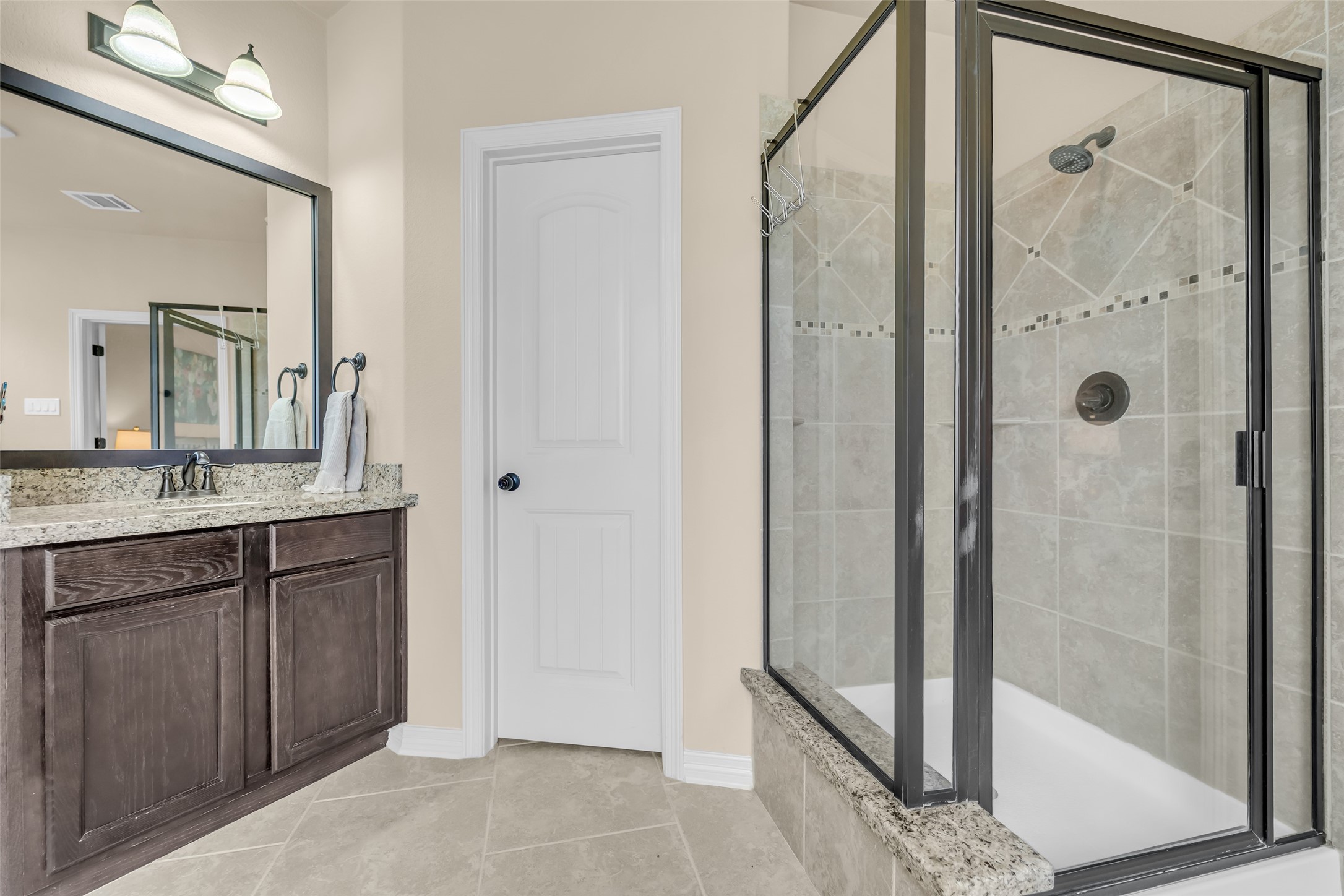 14752 Highland Ranch Drive Montgomery, TX 77316 - Photo 26 of 39 a bathroom with a granite countertop sink mirror and shower