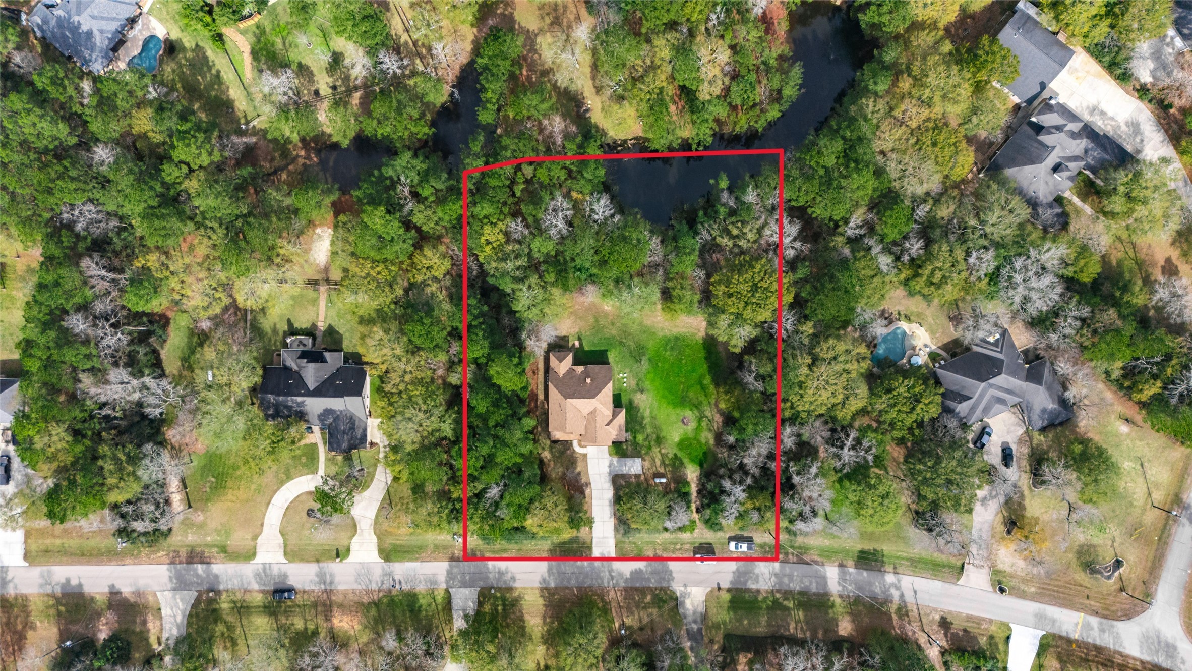 14752 Highland Ranch Drive Montgomery, TX 77316 - Photo 3 of 39 an aerial view of a house with a yard and large trees