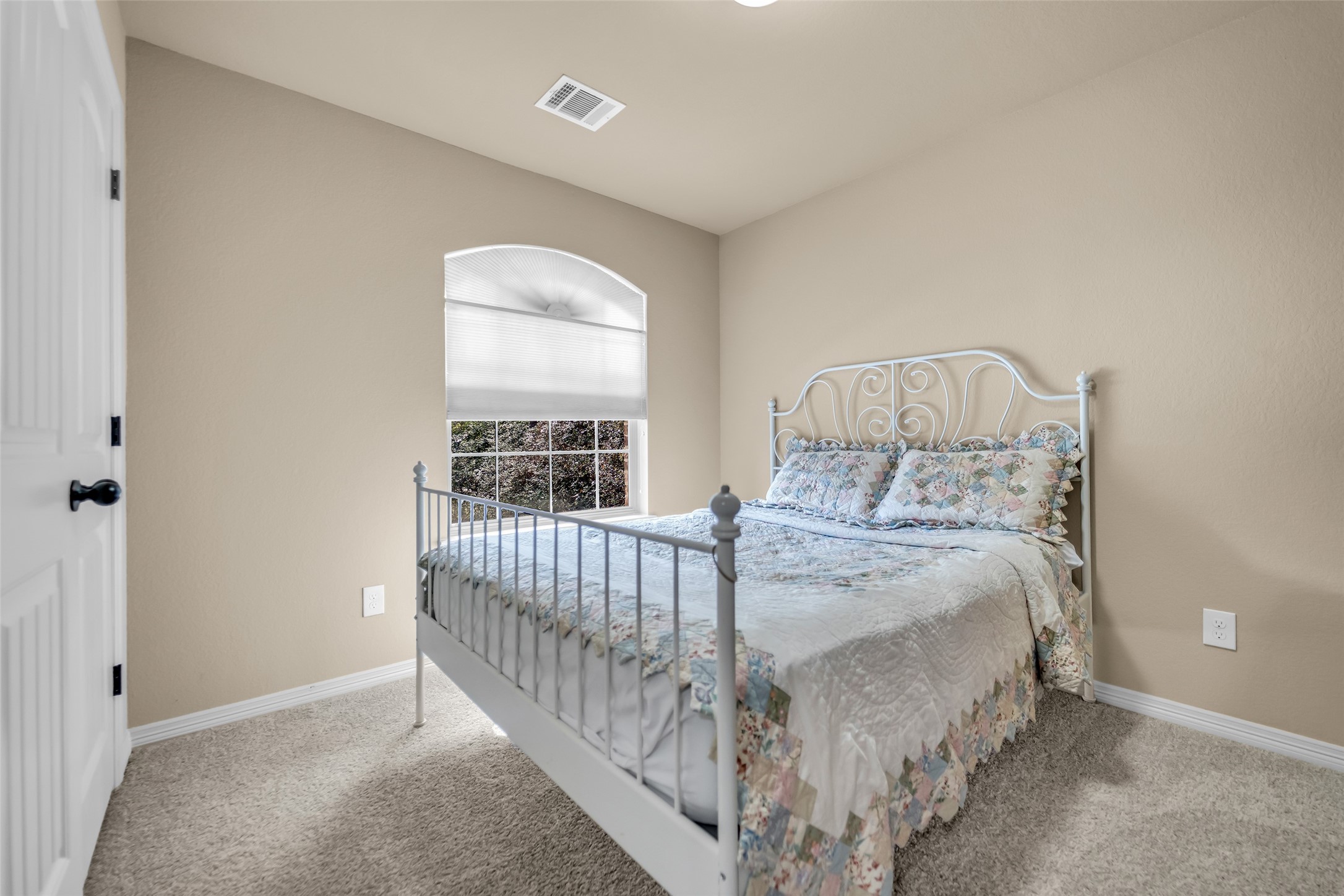 14752 Highland Ranch Drive Montgomery, TX 77316 - Photo 32 of 39 a bed sitting in a bedroom next to a window