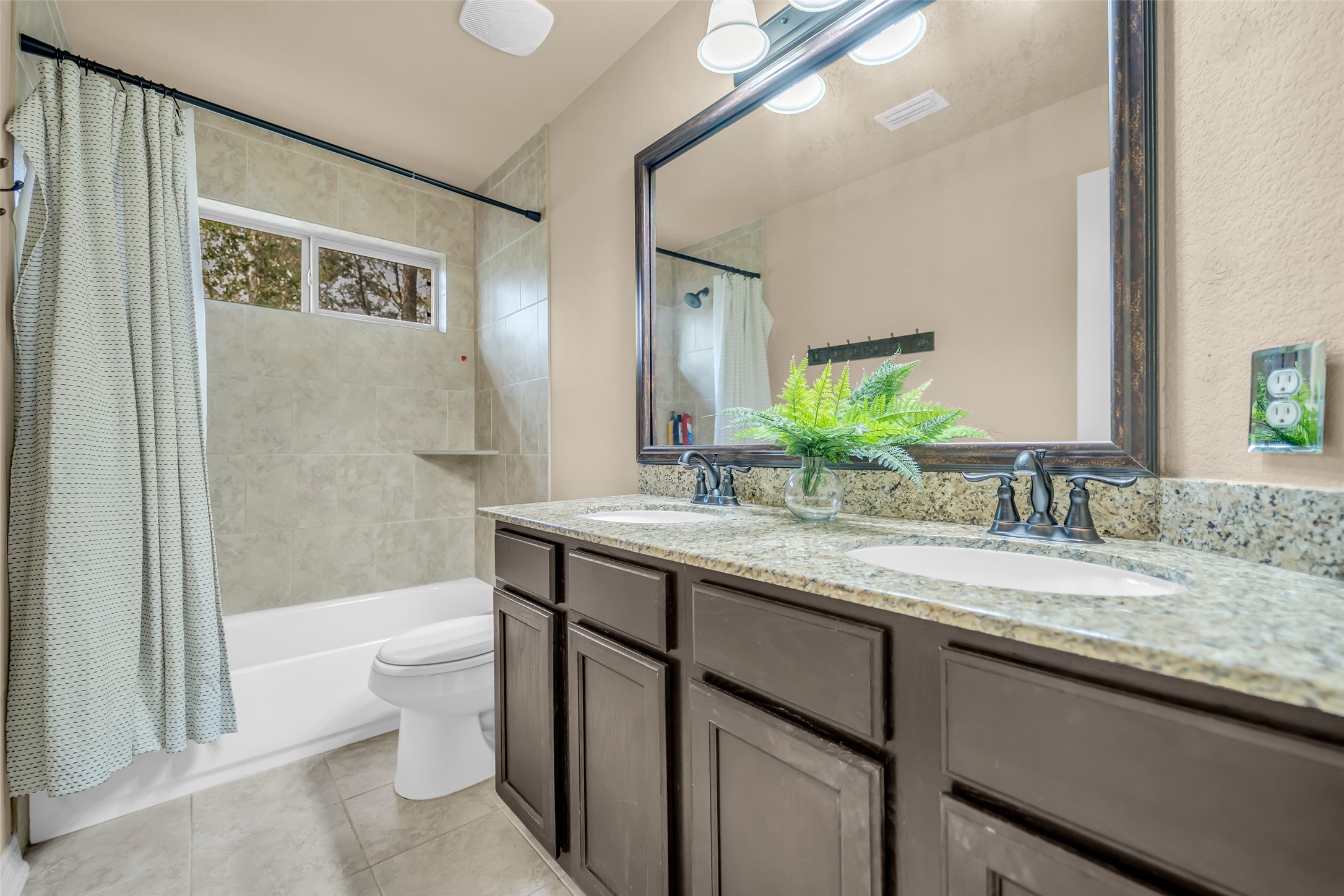 14752 Highland Ranch Drive Montgomery, TX 77316 - Photo 34 of 39 a bathroom with a granite countertop sink toilet and shower