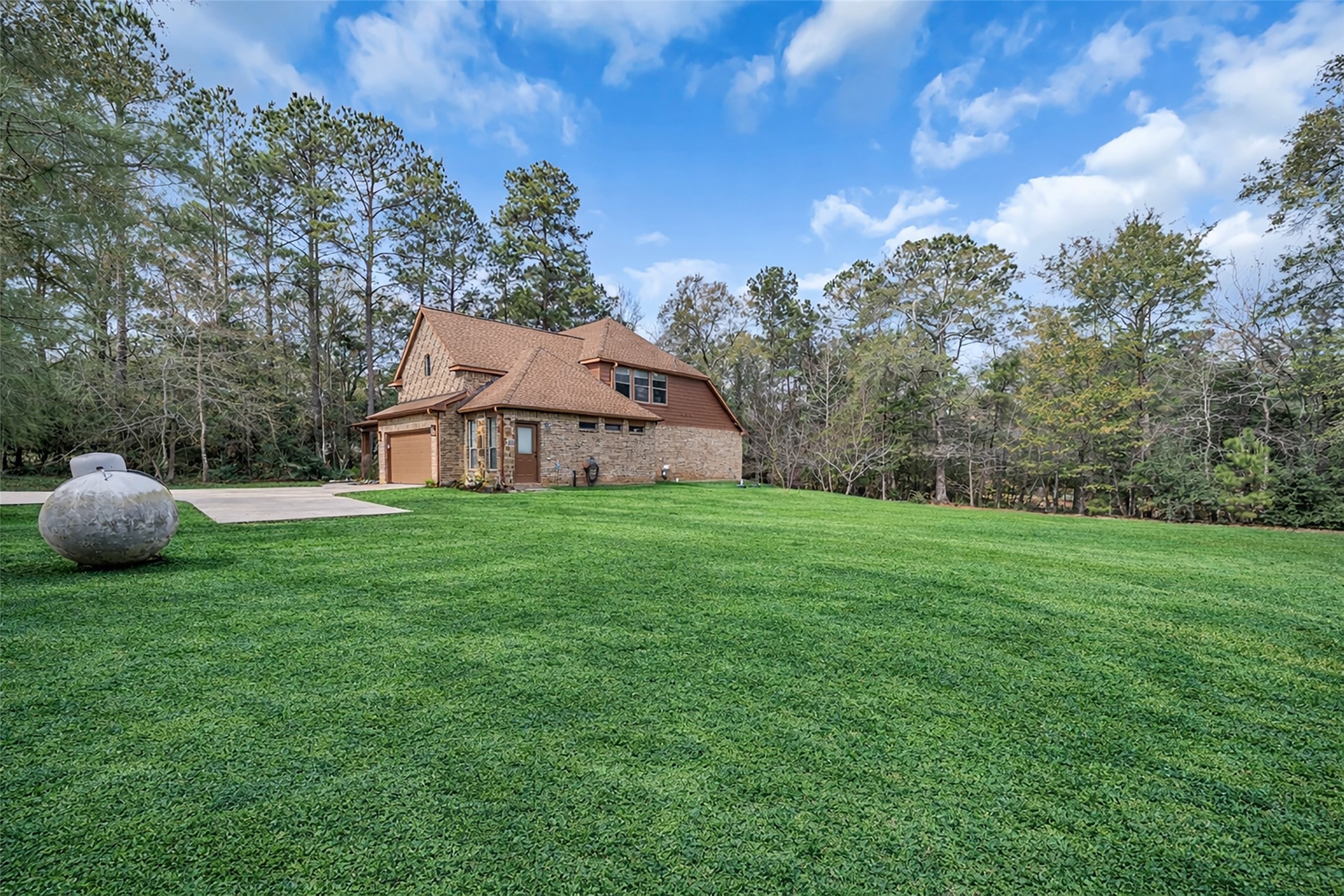 14752 Highland Ranch Drive Montgomery, TX 77316 - Photo 39 of 39 a house with green field in front of it