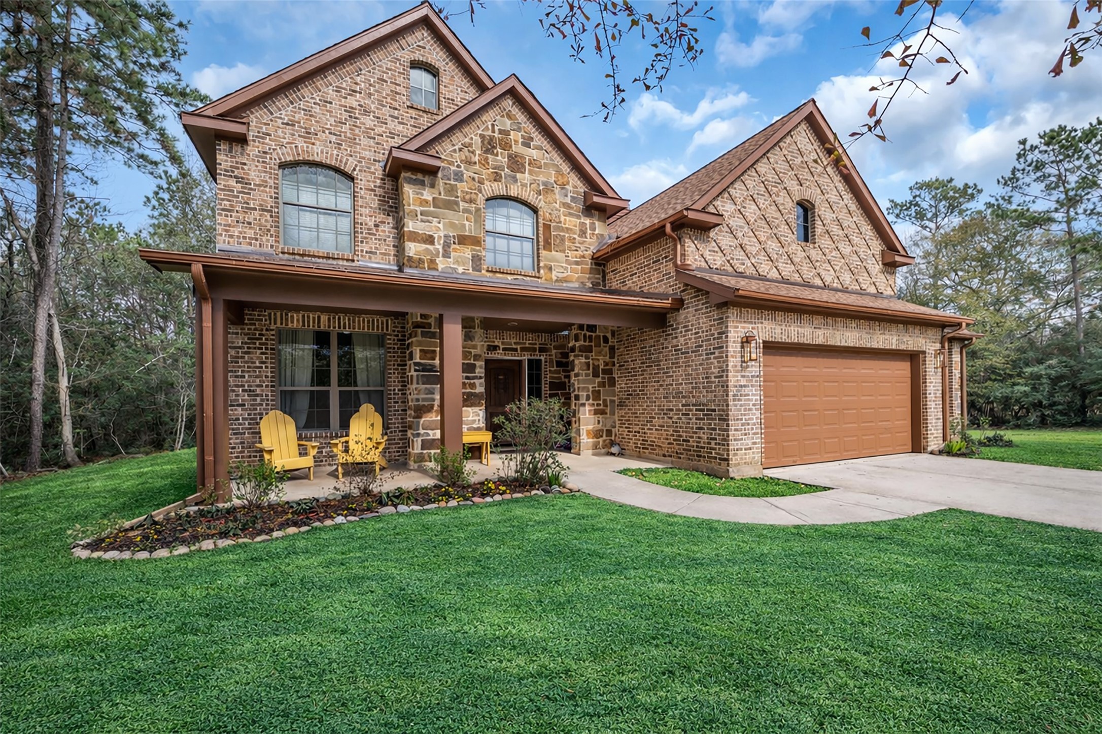14752 Highland Ranch Drive Montgomery, TX 77316 - Photo 6 of 39 a front view of a house with a yard and garage