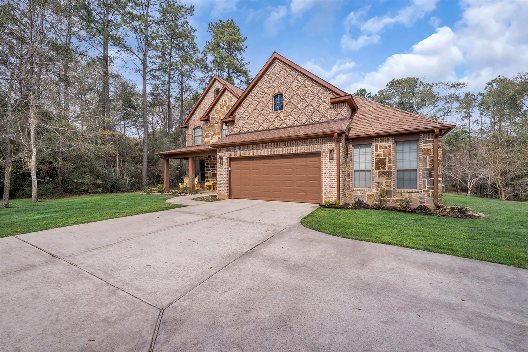 14752 Highland Ranch Drive Montgomery, TX 77316 - Photo 7 of 39 a front view of a house with a yard and garage