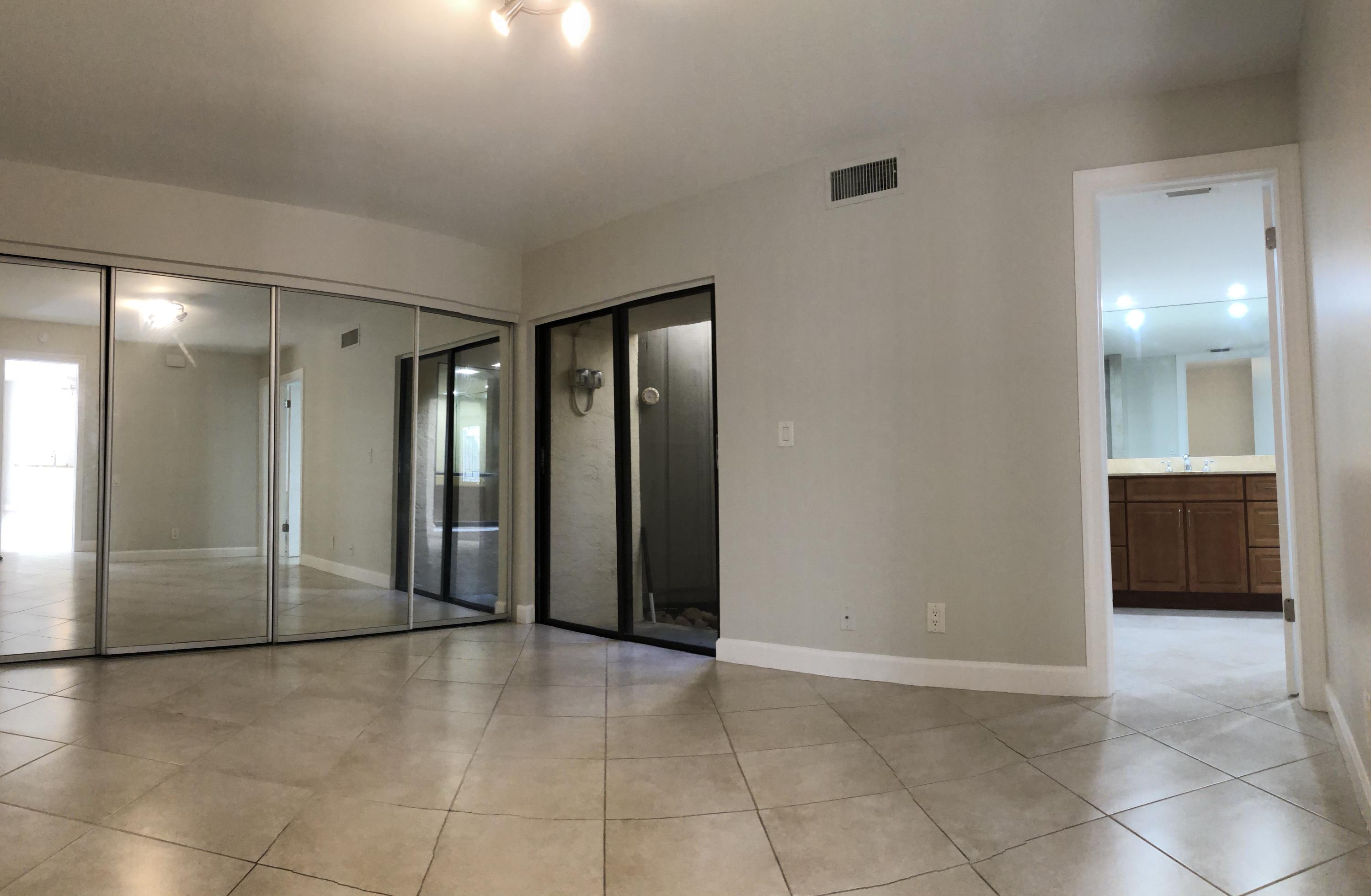 1605 Highway 1, Unit 14C Jupiter, FL 33477 - Photo 17 of 32 Master Bedroom