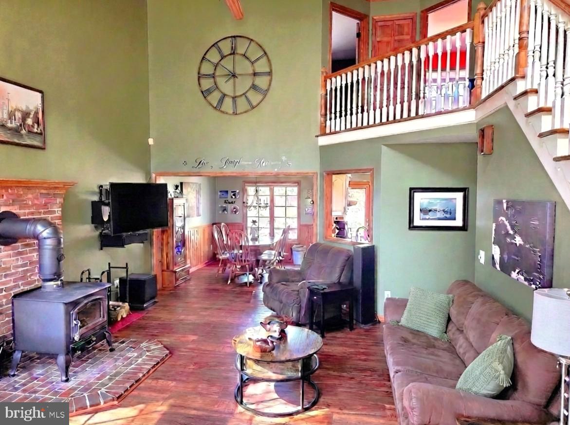 5632 Galestown - Reliance Road Rhodesdale, MD 21659 - Photo 13 of 25 a living room with furniture a rug and a flat screen tv