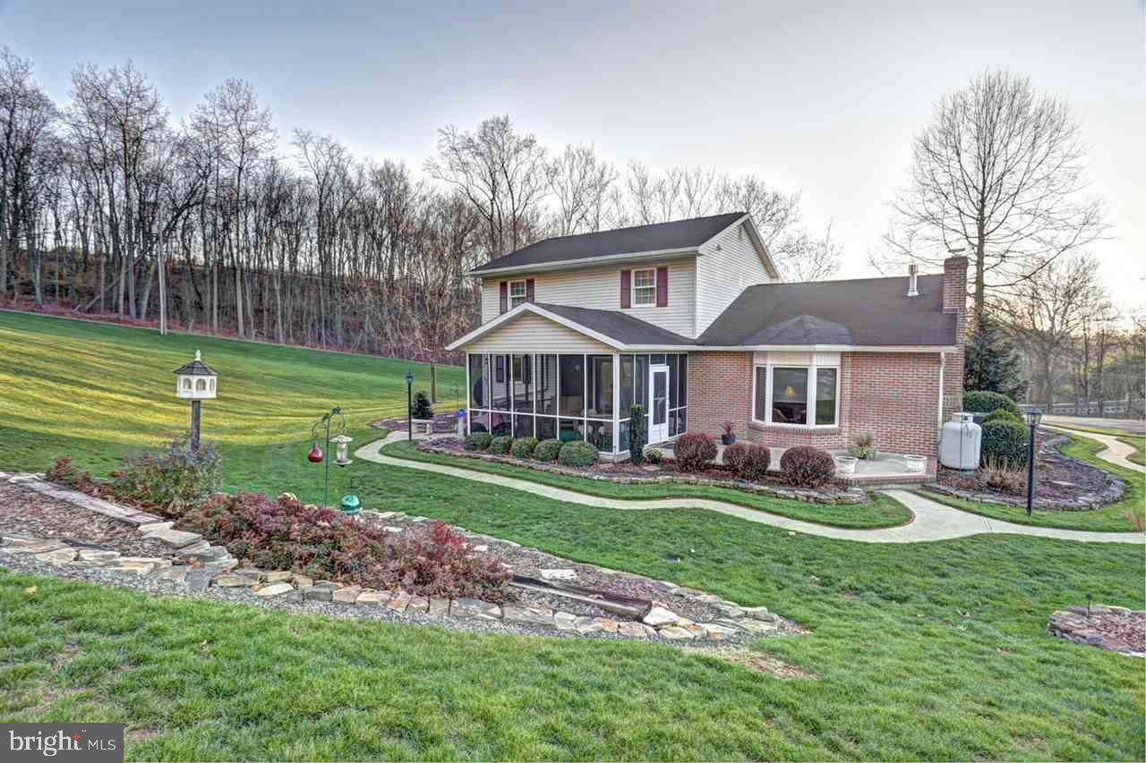 5 Rettinger Road Halifax, PA 17032 - Photo 23 of 25 a view of a house with a big yard and large trees