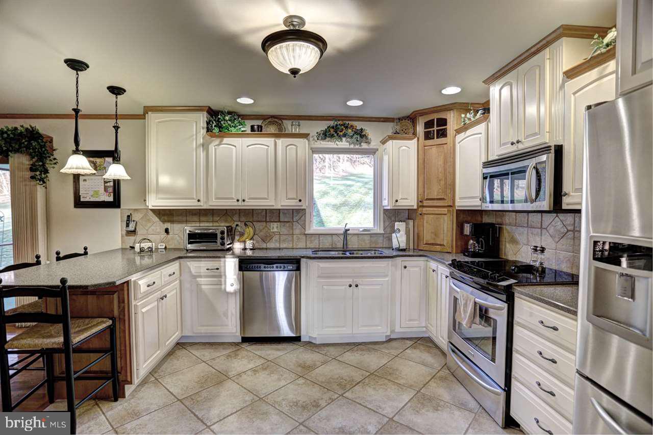 5 Rettinger Road Halifax, PA 17032 - Photo 9 of 25 a kitchen with cabinets appliances and a center island