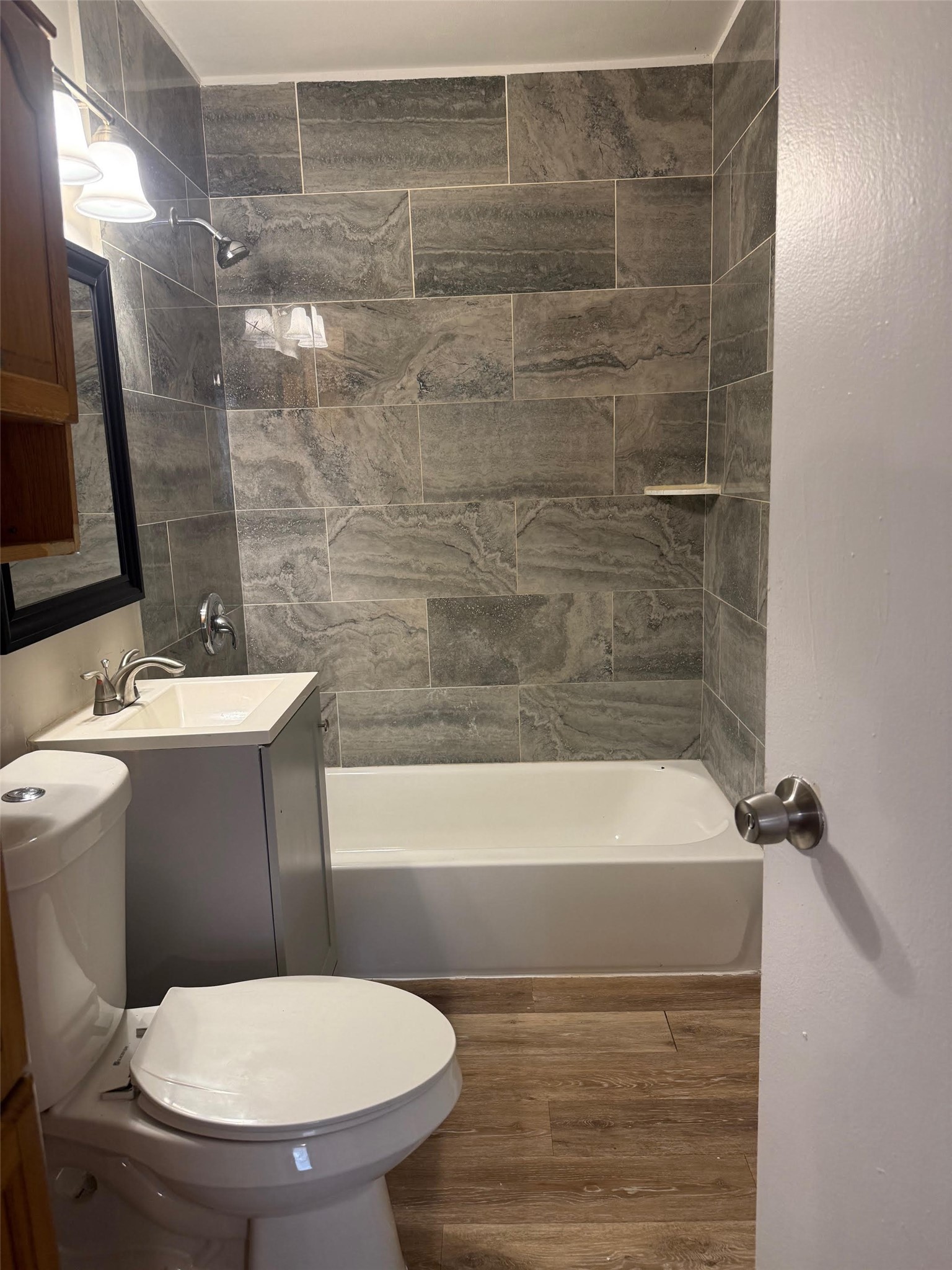 5933 Southgood Street Houston, TX 77033 - Photo 4 of 10 a bathroom with a sink toilet and shower