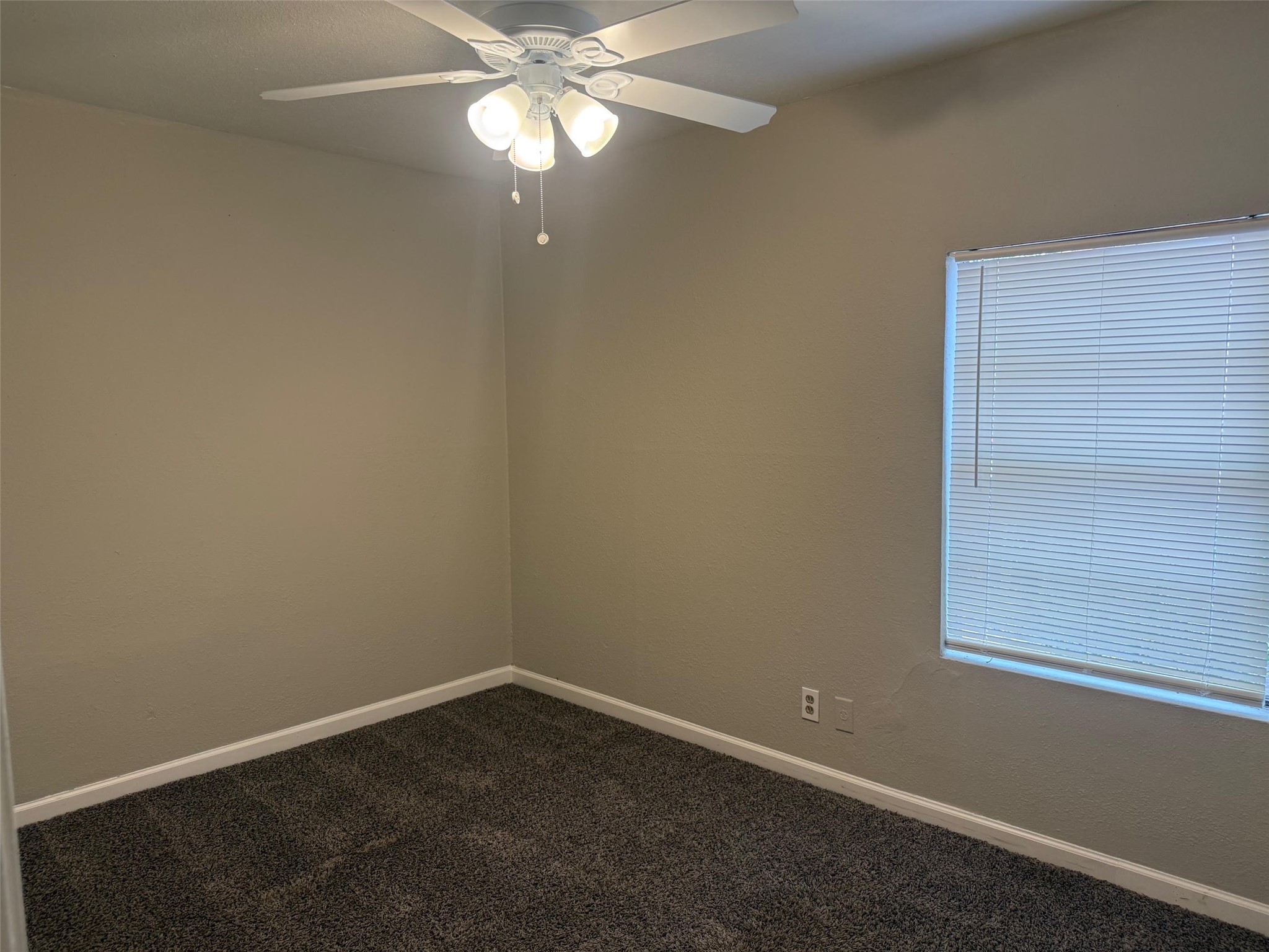5933 Southgood Street Houston, TX 77033 - Photo 5 of 10 a view of an empty room with a window
