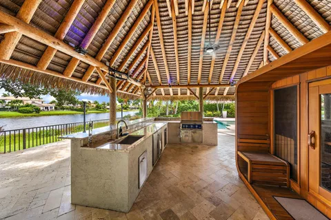 an aerial view of residential house with outdoor space and swimming pool