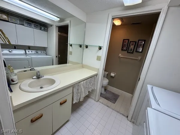 a bathroom with a sink and mirror