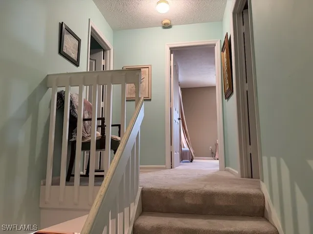 a living room with a furniture and a stairs