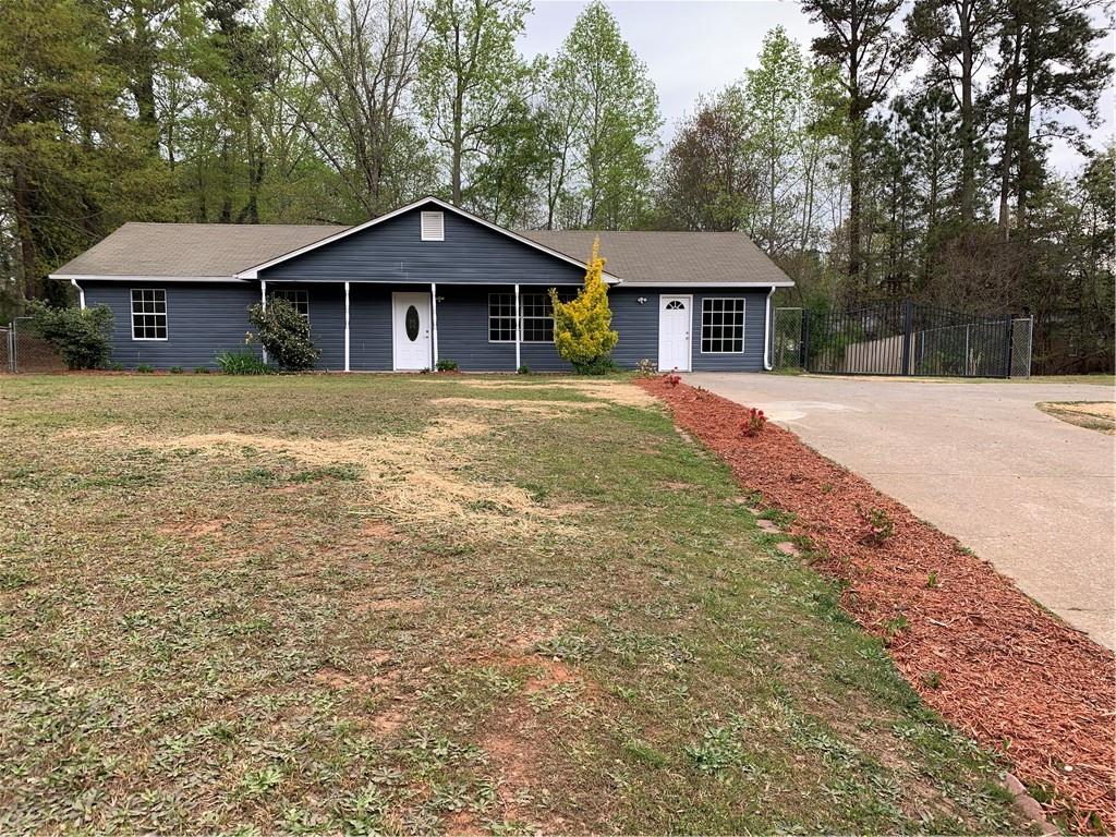 5322 Browns Bridge Road Gainesville, GA 30504 - Photo 1 of 1 a front view of a house with a garden
