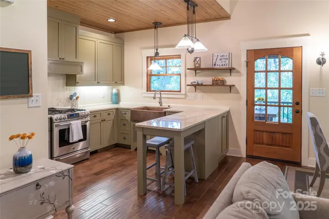 a kitchen with a sink stove and cabinets