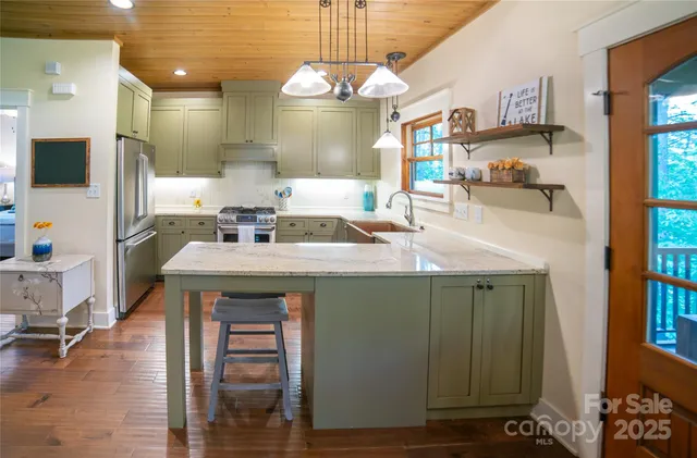 a bathroom with a sink a mirror and a shower